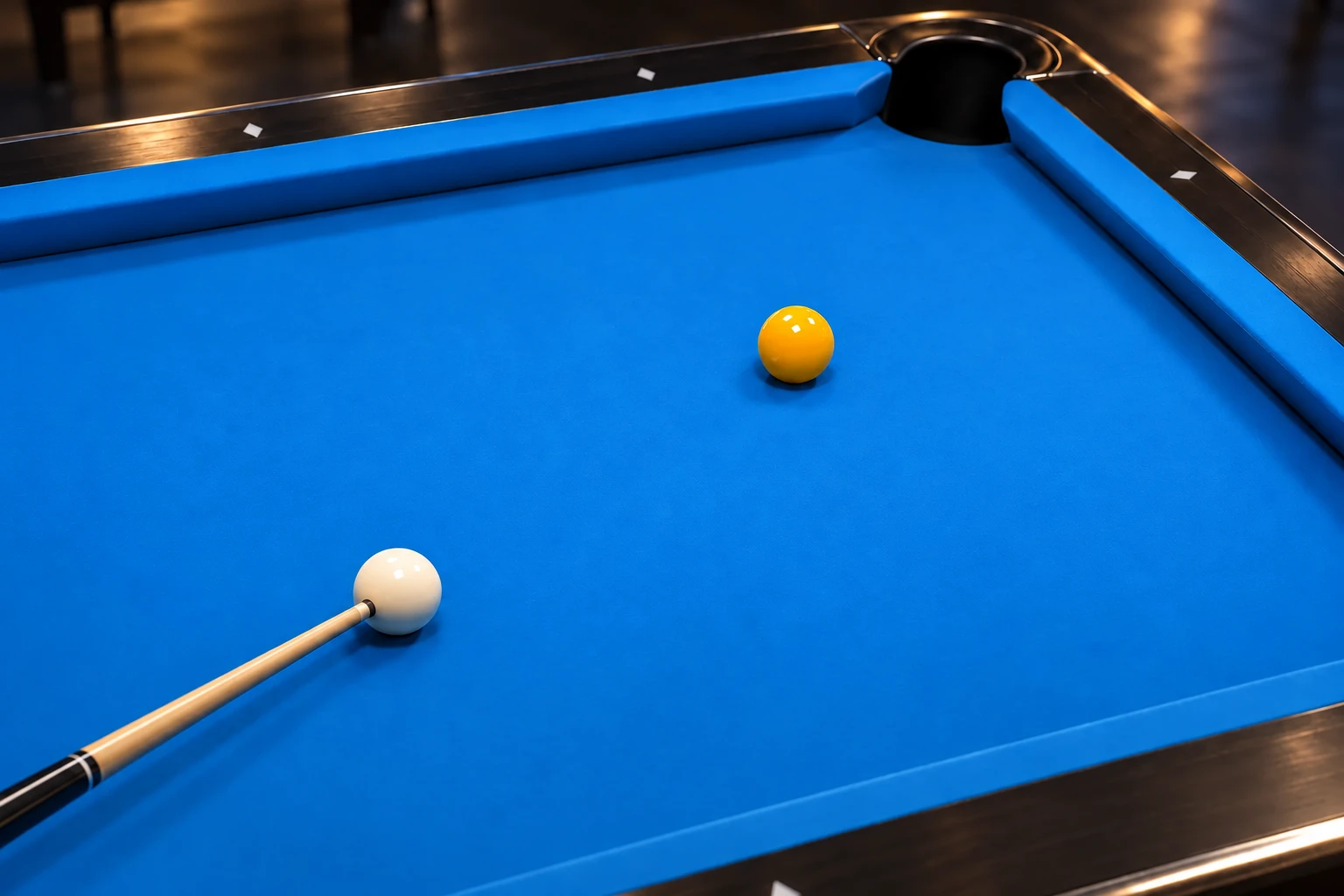 Generic cue and one white cue ball near one yellow object ball on blue pool cloth, with no route overlays