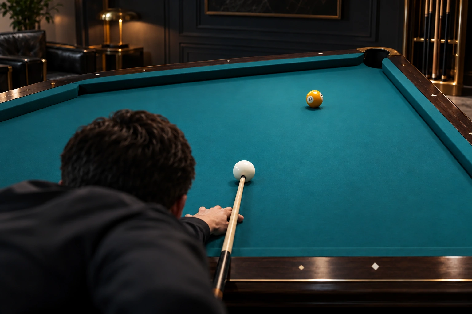 Anonymous player addressing one white cue ball toward one object ball on an unmarked table