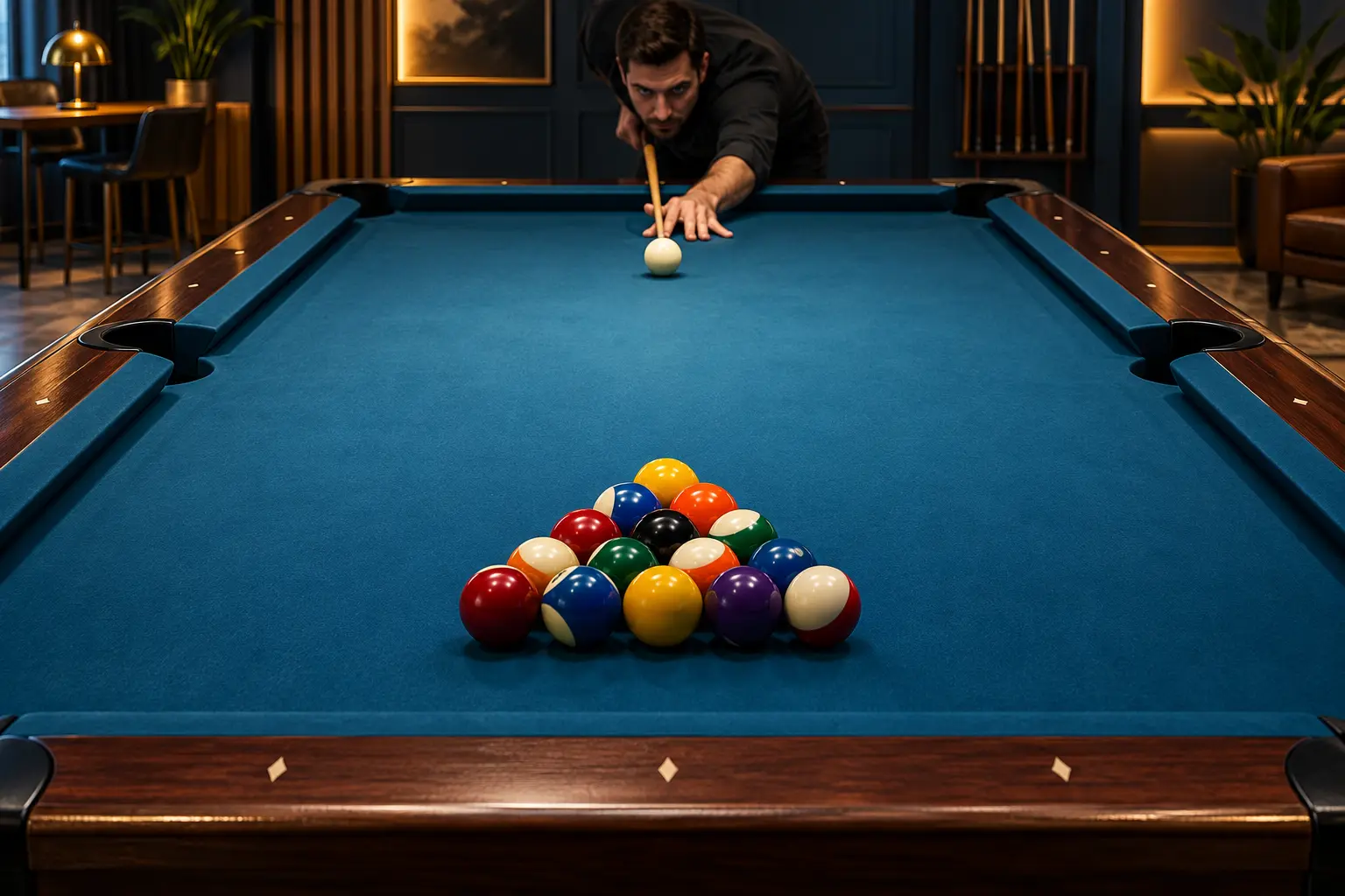 Anonymous player addressing a white cue ball toward a full triangular rack on a pool table