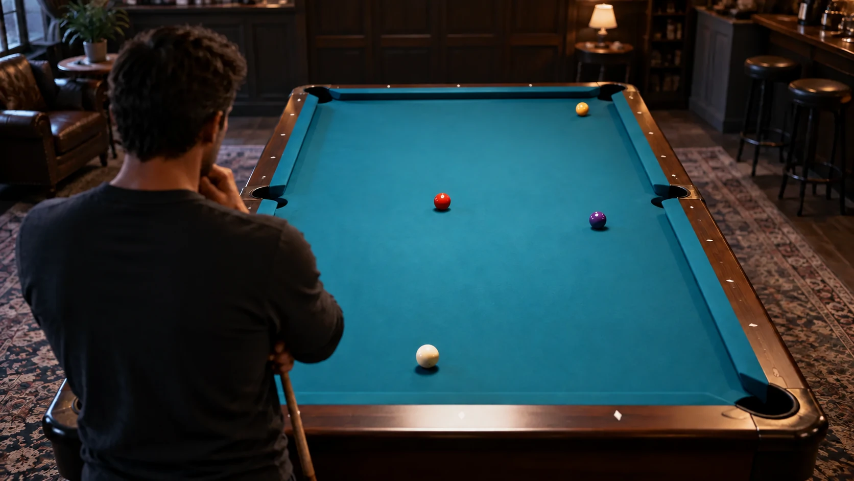 Pool player standing behind a table to compare the current stationary ball layout before choosing a shot