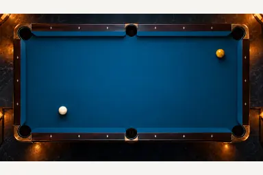 One white cue ball and one yellow object ball resting on blue pool cloth, without a drawn trajectory