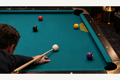 Editorial pool scene with a narrow gold short-side finish area beside an object ball and rail, with no predicted trajectory